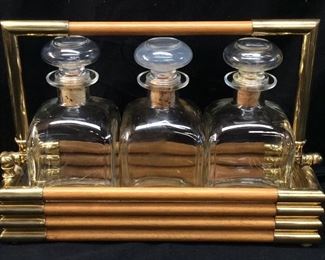 (3) DECANTERS IN A BOTTLE HOLDER
