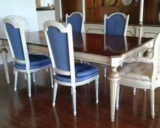 DINING TABLE MADE FROM A SOLID PIECE OF MAHOGANY ANTIQUE IVORY FLUTED LEGS WITH GOLD CAPS 