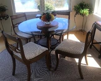 Sunroom round glass table
chairs match Dining room set. 