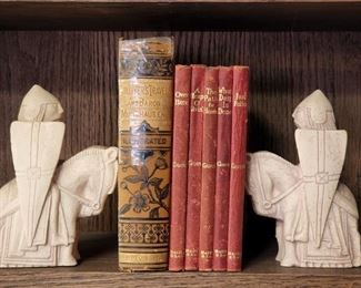 Stone knight bookends. Guest red leather bound books; antique Gulliver's Travels and Baron Munchausen