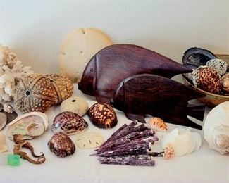 Shells, seahorses, sand dollars, coral, sea urchin spines, carved wood fish
