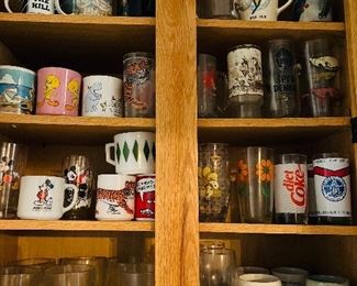 Tons of vintage collectible  mugs.