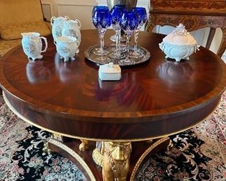 CARVED BANDED MAHOGANY CENTER TABLE WITH GILT GRIFFIN ACCENTS
