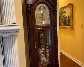 HOWARD MILLER GRANDFATHER CLOCK WITH BANDED MAHOGHANY CASE