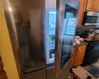 Has touch see through door that can access 1st part of refrigerator 