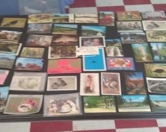 Huge lots of postcards, ephemera. One of these is Buffalo Bill William Cody and another one has a scantily clad French woman. 