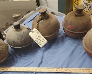 These are the old smudge pot lanterns used by road crews as hazard lights back in the old days. 