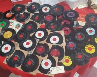 several bulk lots of old vinyl records in this auction.  In this lot there are several "White Label" promotional records that were not sold in stores but used by promoters in trying out new bands / artists.  Very collectible on obay. 