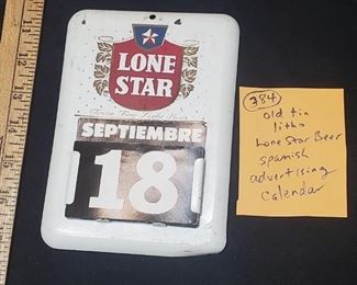 Lone Star Beer pressed steel or tin litho advertising calendar in Spanish.  All the cards for the months and days are complete. 