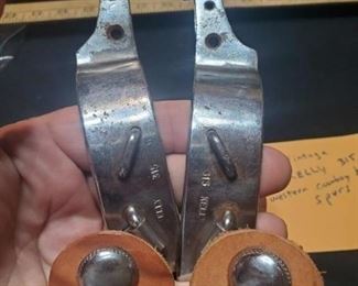 Vintage pair of cowboy boot western spurs. Leathers look to be in good shape and both spurs are marked KELLY. 