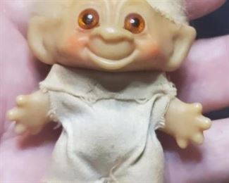 2 DAM troll dolls, a male and female(not pictured here) are in this auction.  These are from the 1960s, think the eyes may be glass.  This one is marked DAM on the back and the girl is marked C64.  