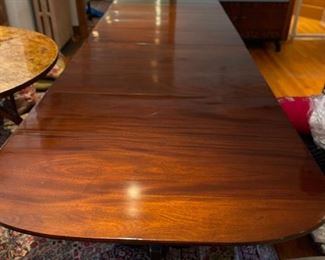 Early 19th Century Antique English Banquet Mahogany Three Pedestal Dining Table with Brass Claw Feet. Purchased from Richard Norton Antiques. Tables Measures 164" L x 41.5" D x 29.5" H. With Two Pedestals, Table Measures 69" W x 41.5" D x 29.5" H. There are Three Leaves - 30" W, 28" W & 36" W to create myriad seating arrangements. Photo 1 of 4.