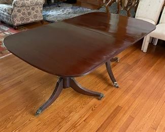 Early 19th Century Antique English Banquet Dining Table with Brass Claw Feet. Purchased from Richard Norton Antiques. Tables Measures 164" L x 41.5" D x 29.5" H. With Two Pedestals, Table Measures 69" W x 41.5" D x 29.5" H. There are Three Leaves - 30" W, 28" W & 36" W to create myriad seating arrangements. Photo 2 of 4.
