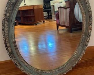 Large Blue Gesso Oval Mirror with Foliage Trim in an Antiqued Finish - 2 available. Circa 1970s. Measures 32" H x 27" W. Photo 1 of 2.