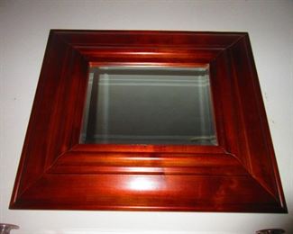 One of a pair of cherry wall mirrors