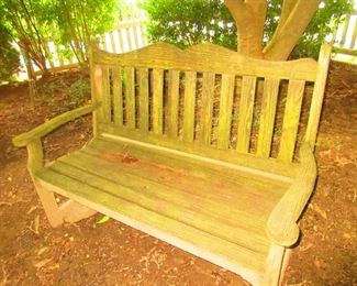 One of two weathered teak benches