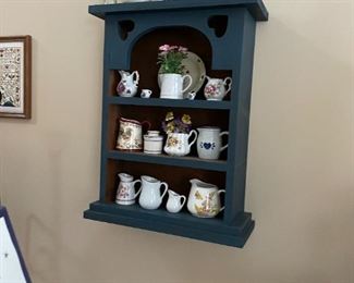 . . . nice wall shelf with creamer collection