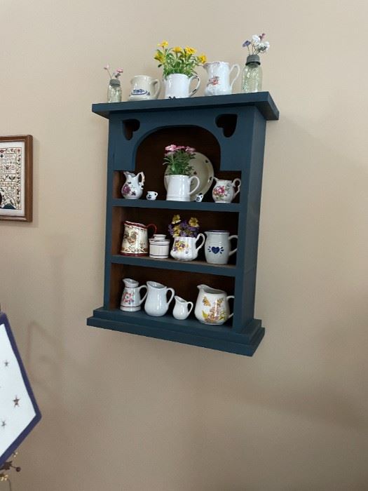 . . . nice wall shelf with creamer collection
