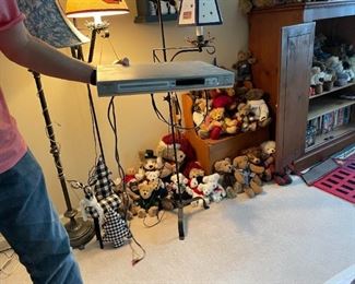 . . . bear collection in background -- DVD player in foreground