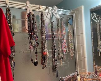 . . . this is a multi-use shower!! Clean up on the inside, hang your necklaces on the outside!