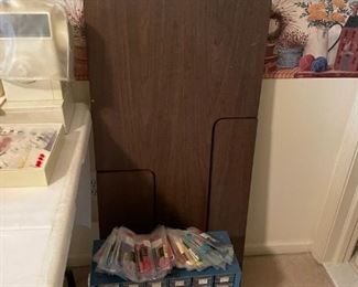 . . . sewing table and sewing organizer -- look for lots of sewing supplies, threads, elastics, buttons, etc.