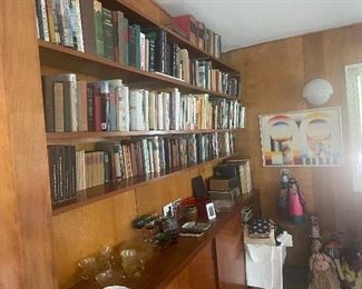 World travelers book collection and African artifacts