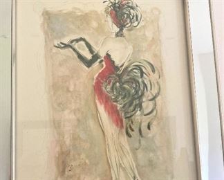 One of three mirrored framed show girl pictures