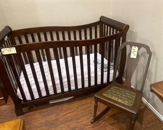 Nice little dark wood crib- baby bed. Antique teen size rocking chair. 
