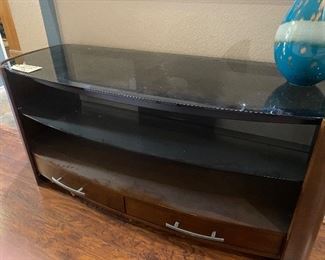 Nice smoked glass media tv stand. Very classy, contemporary style. 