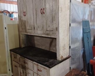 Early 1900s Kitchen cupboard and base from our home. Chippy white paint over green, red Bakelite handles.  52 1/2" wide by 83 " tall. 