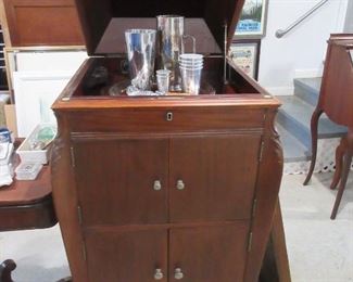 Victrola cabinet, which not only is a great bar, but also holds stereo components or record albums perfectly. Refinished walnut. A family piece rescued from a cabin. 