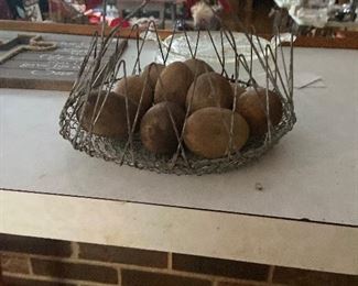 Vintage egg basket with wooden eggs