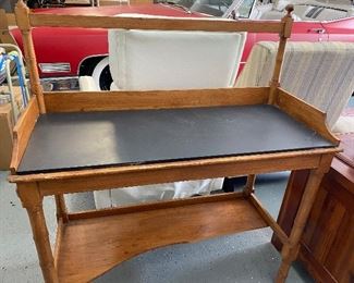 Bar with removable slate top, damage to bottom shelf and corner of slate. Cabinet in following pics sits on top maybe