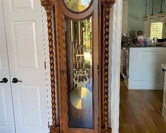Grandfather clock shipped from Switzerland. 7’3” tall. Lauris on the face. Working, keeps time, chimes.