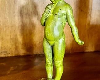 531. 8" Painted Green Metal Figurine of Child