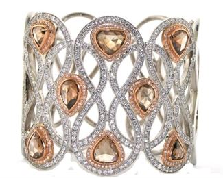 Very fine designer bangle bracelet. Gold and Diamonds