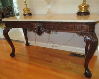 SIDE TABLE LIONS HEAD DESIGN 32 INCHES HIGH 60 INCHES LONG  23 INCHES WIDE