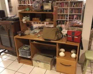 Downstairs- Desk, more books, cabinet with glass front