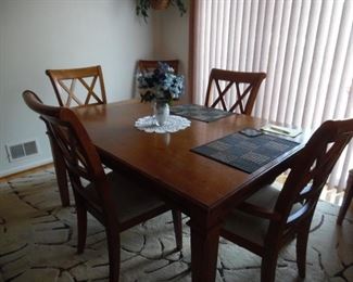 Solid wood table and chairs kitchen set, with spectacular area rug