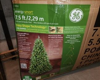 pre-lit 7.5 foot artificial Christmas tree, with lights and pine cone decorations