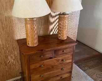 Dresser/chest of drawers and matching lamps.