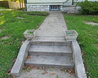 Pair of matching concrete planters