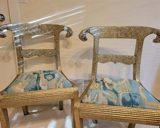 Pair of vintage Anglo-Indian dowry side chairs with ram's head accents.