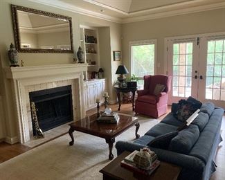 Blue Damask 7 ft sofa, Councill Craftsmen string inlay satin banded ball and claw foot coffee table 38" x 38" x  16.5" , Carved round Center Table with ball & claw feet, framed gilt wood beveled mirror above mantle- (58 x 44"), brass fireplace tools and misc. accessories