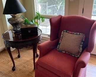 1 of 2 satin stripe wingback chairs (sold separately), carved center table with burled top and ball & claw feet 
