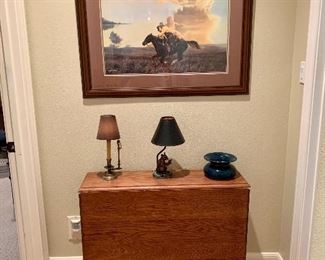 Framed print "Just for the Heck of It" by cowboy artist Tim Cox,  drop leaf oak table in transitional deco / nouveau style shown closed