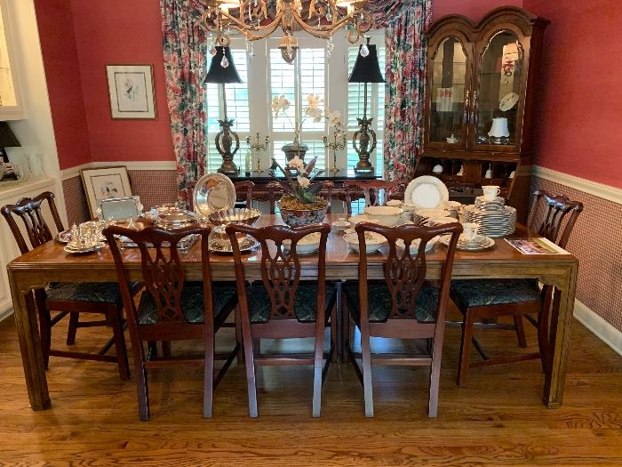 Drexel dining room table with two leaves surrounded by 8 Hickory Chippendale style chairs in mahogany- all excellent condition