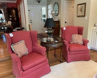 A pair of satin stripe wingback chairs (sold separately), carved center table with burled top and ball & claw feet 