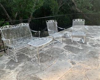 wrought iron glider, coffee/ cocktail table . pair of rockers