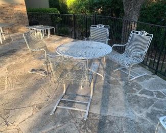 set of 4 wrought iron rockers and table